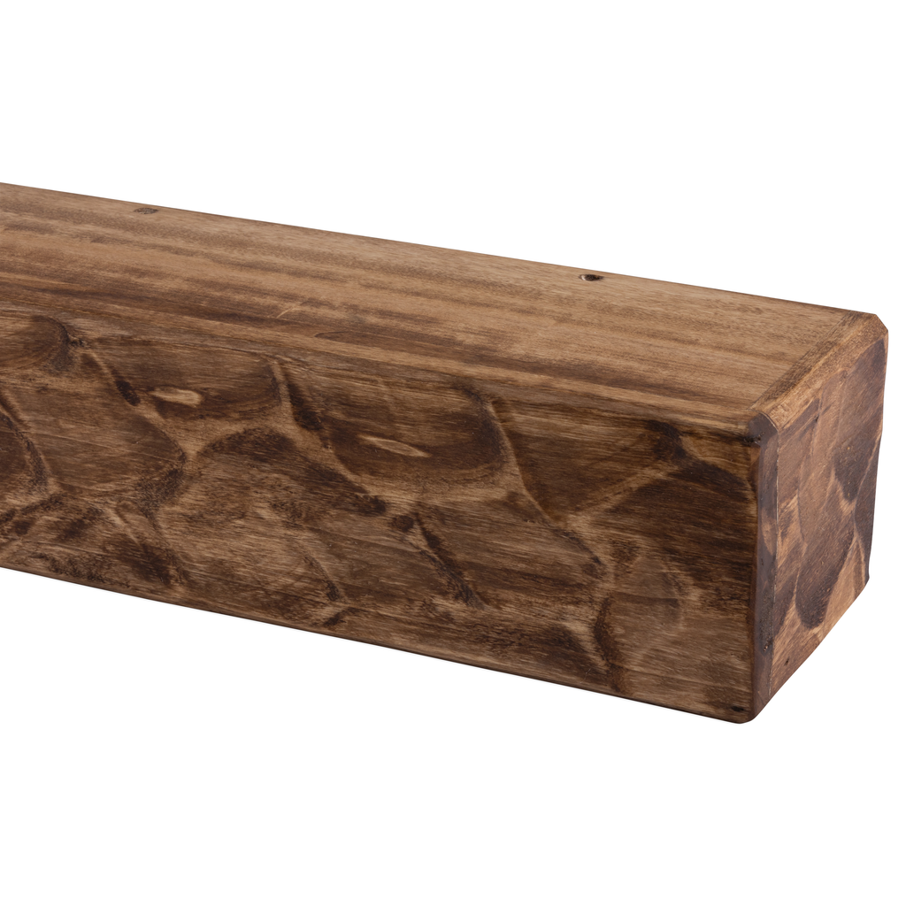 Rough-hewn wood mantel shelf, medium-brown tone with knotty grain and beveled edges