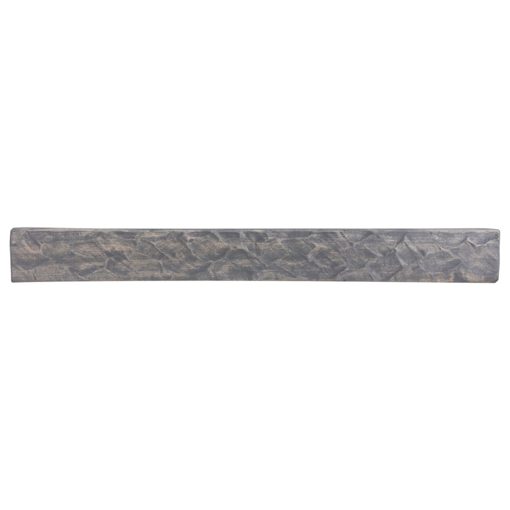 Rough-hewn dark gray wood fireplace mantel shelf with textured grain pattern
