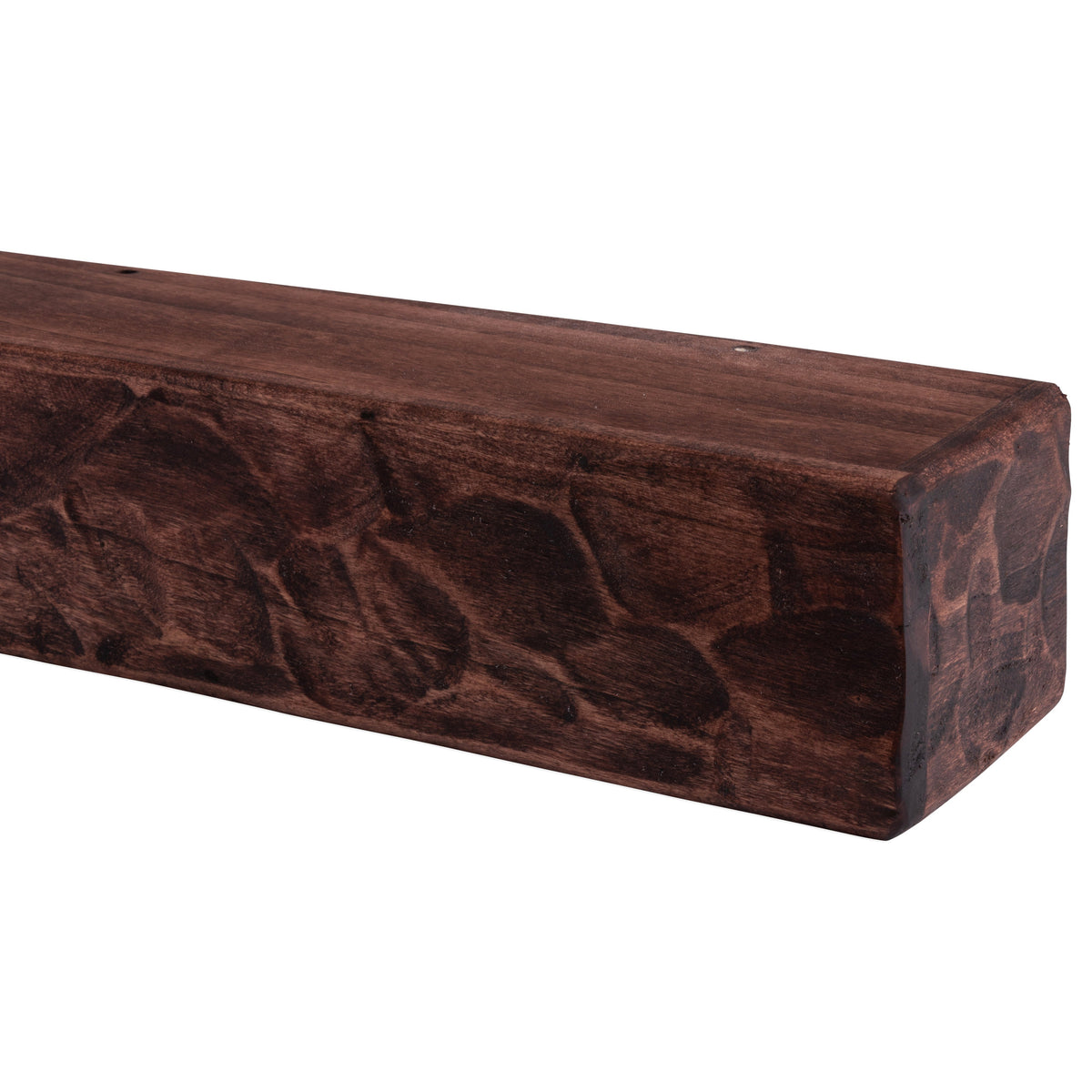Rough-hewn wood mantel shelf in deep reddish-brown with knotty grain and rounded corners