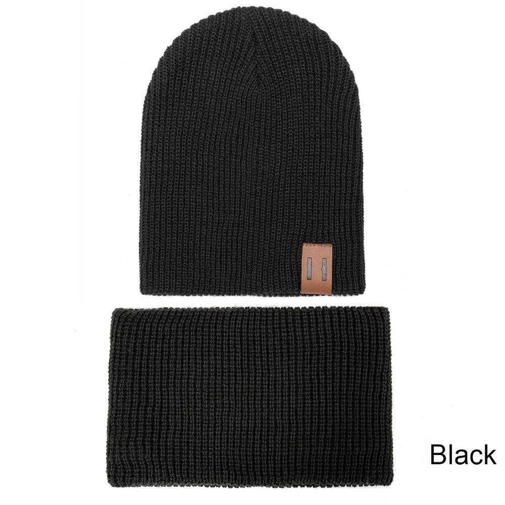 Black knit baby beanie and matching neck warmer with small logo patch
