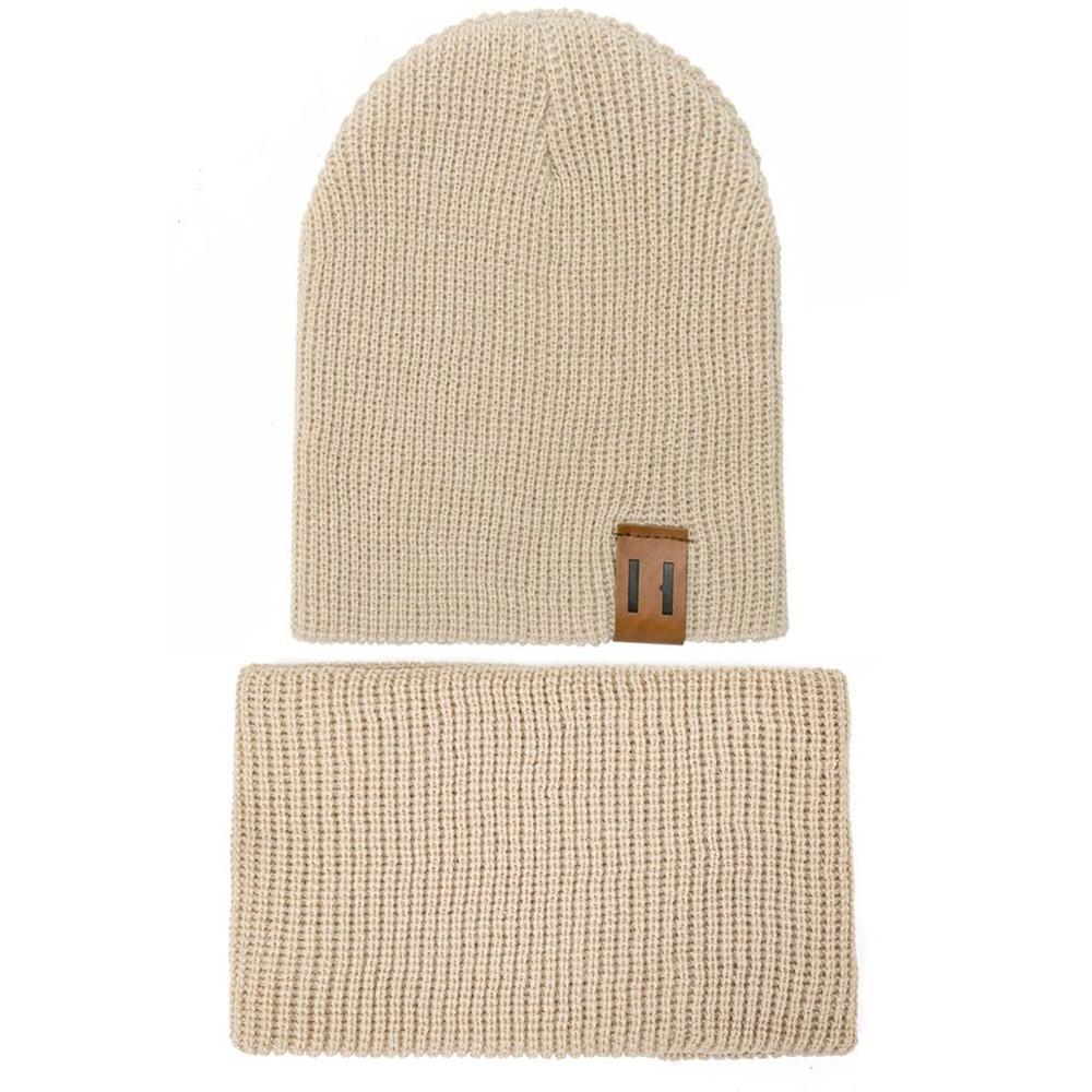 Beige knit baby beanie with matching neck warmer and small logo patch