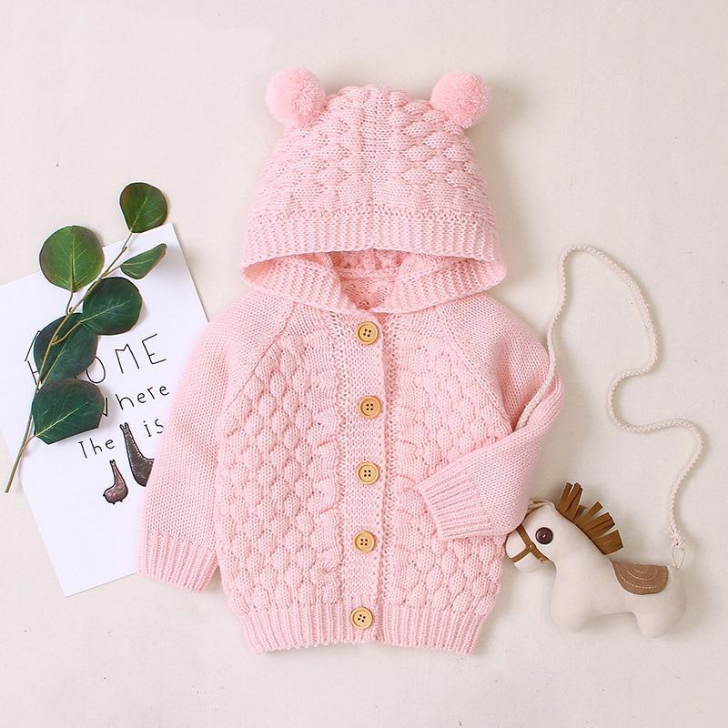 Infant hooded knit jacket, pink, pom-pom hood, button front