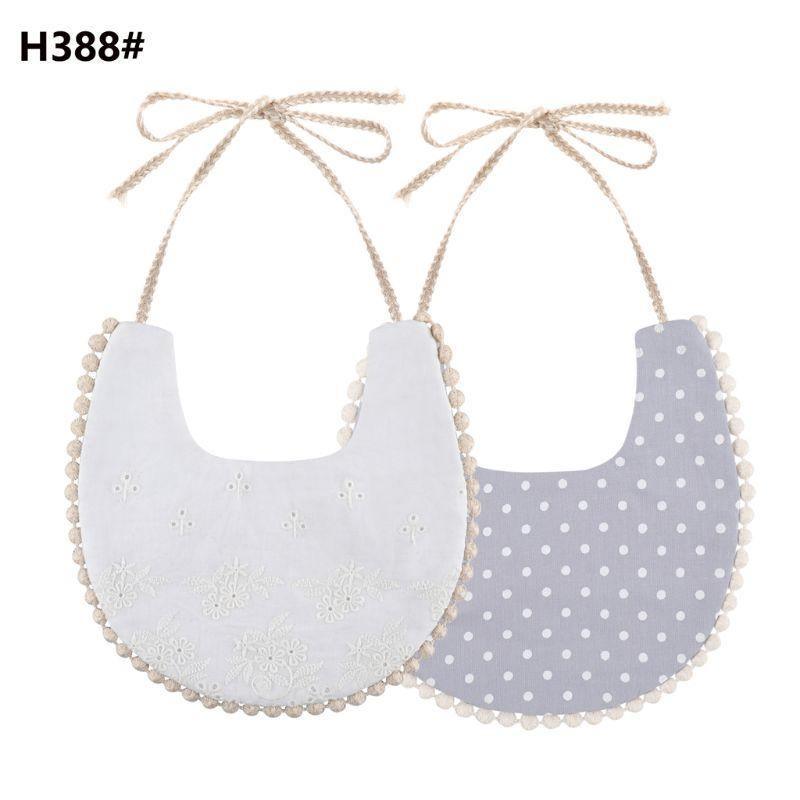 Baby bib set with tassel ties, double-sided white eyelet and grayish dot pattern reverse