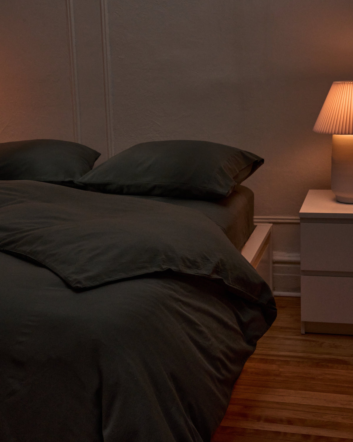 Charcoal duvet cover with two pillowcases on a bed