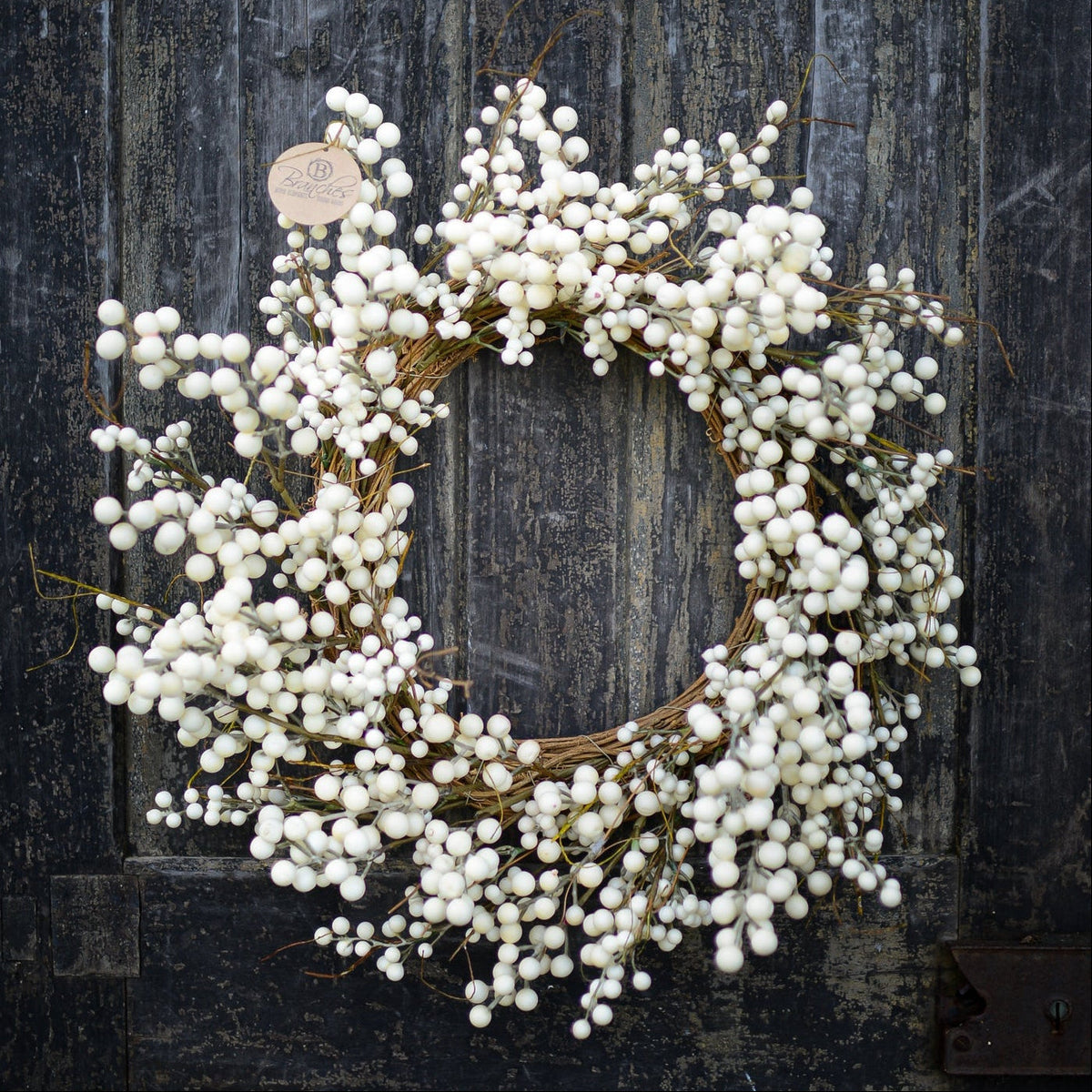 Cream berry wreath with round twig frame and clustered white bead-like berries