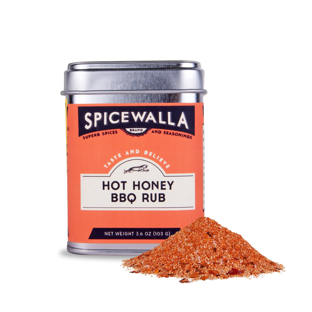 Spicewalla Hot Honey BBQ Rub seasoning can with a mound of orange-red spice rub.