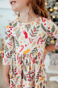 Girls’ 3/4 sleeve twirl dress with festive red, green, and gold print