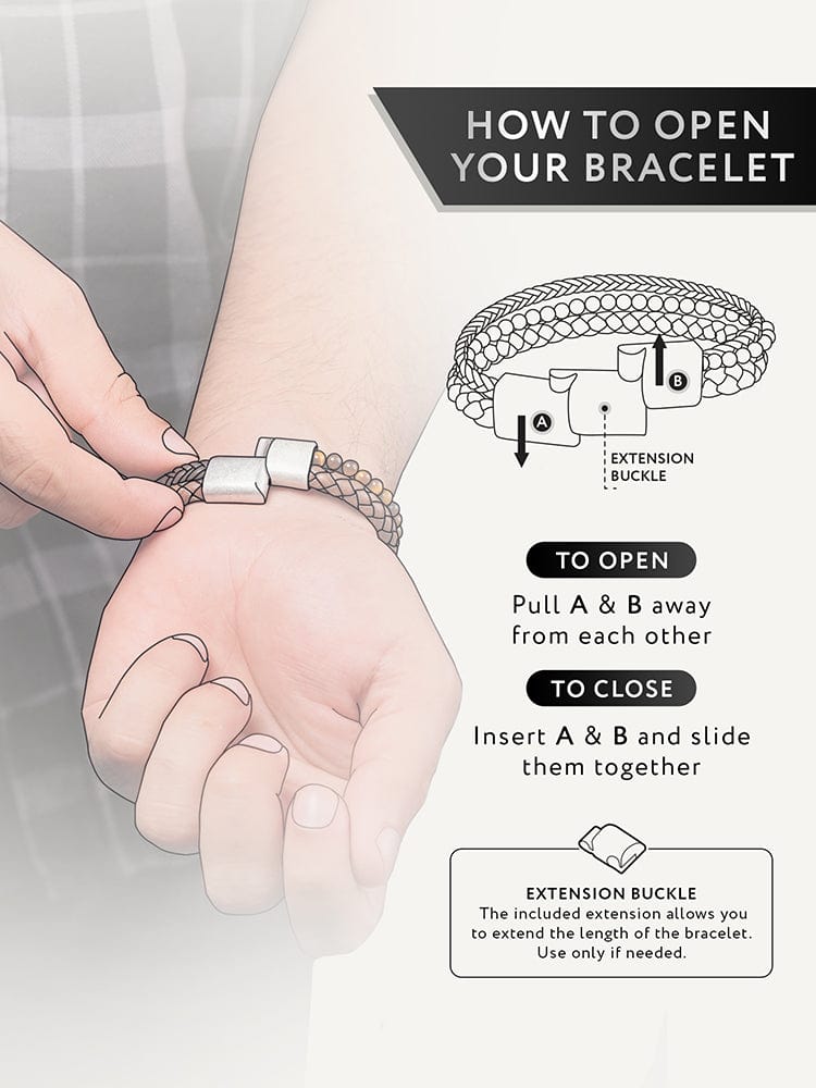 Black leather bead bracelet being opened with extension buckle.