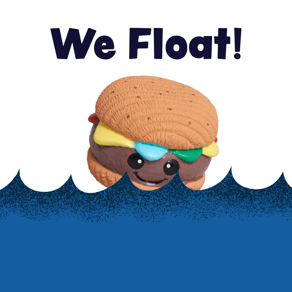 Hamburger Ruff-Tex latex ball dog toy floating on water, brown bun with colorful toppings
