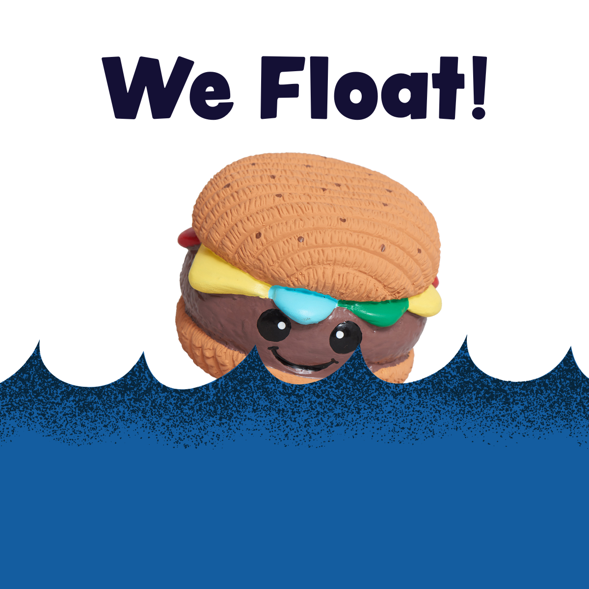 Hamburger Ruff-Tex latex ball dog toy floating on water, brown bun with colorful toppings