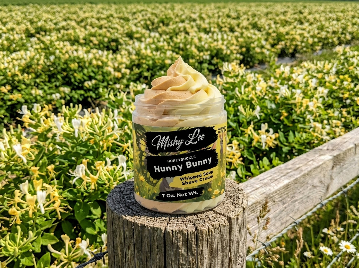 Hunny Bunny whipped soap and shave cream jar on outdoor wood stump in field