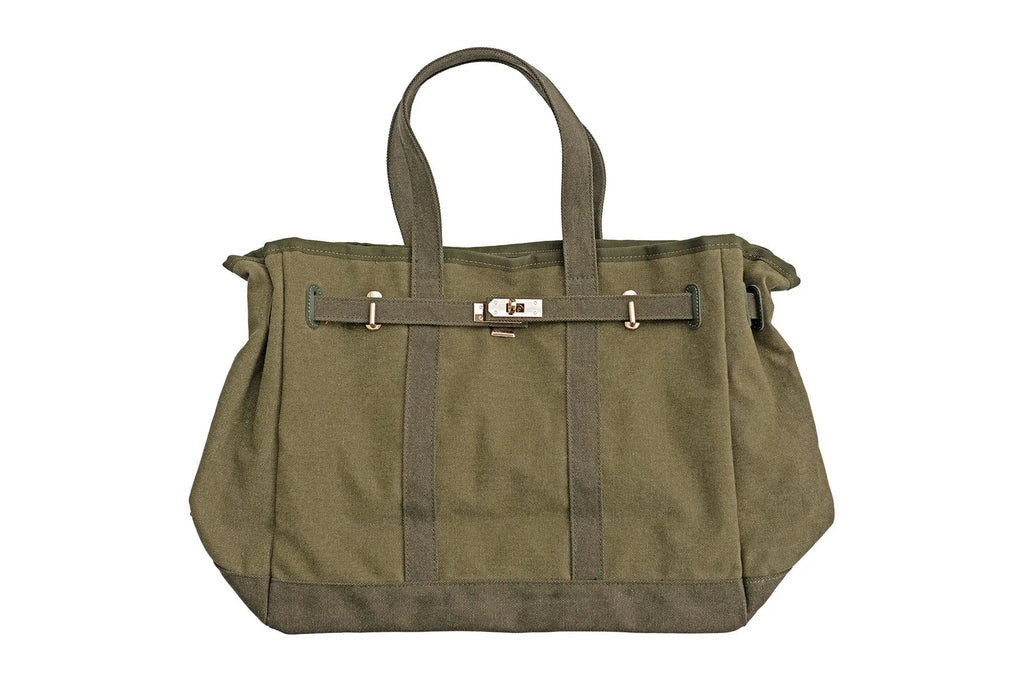 Olive canvas tote bag with belt strap, snap closure, and wide top handles