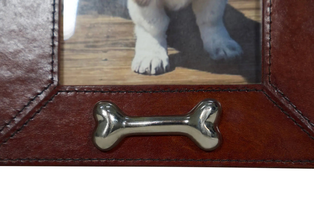 Close-up of silver bone accent on brown leather pet picture frame