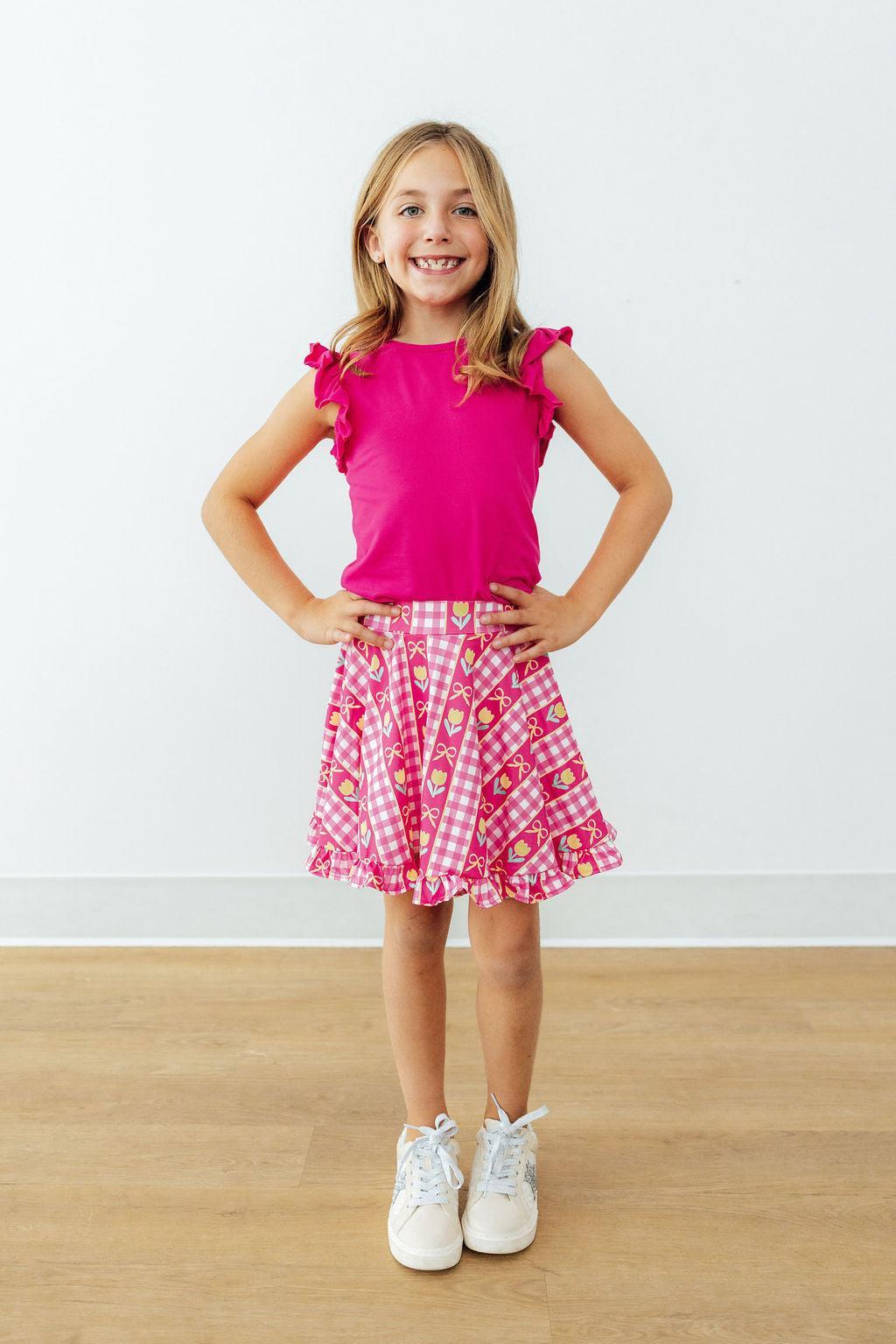 Pink ruffle twirl skort with heart-and-tulip check print, flared tiered skirt, elastic waist
