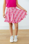 Girls' pink ruffle twirl skort with heart-and-tulip check pattern, tiered skirt hem