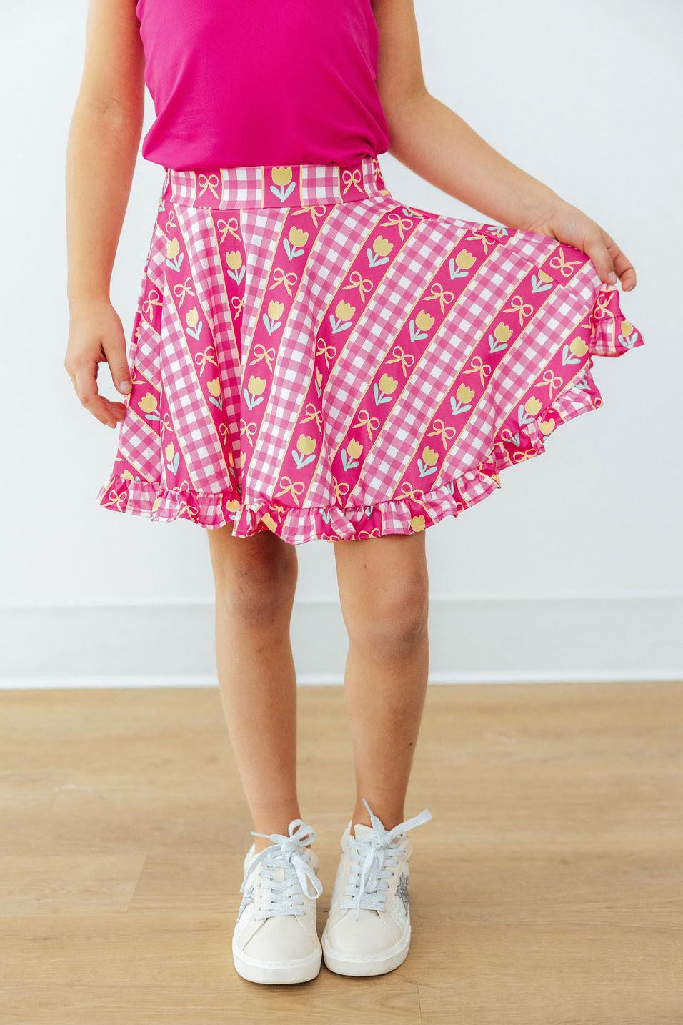 Girls' pink ruffle twirl skort with heart-and-tulip check pattern, tiered skirt hem