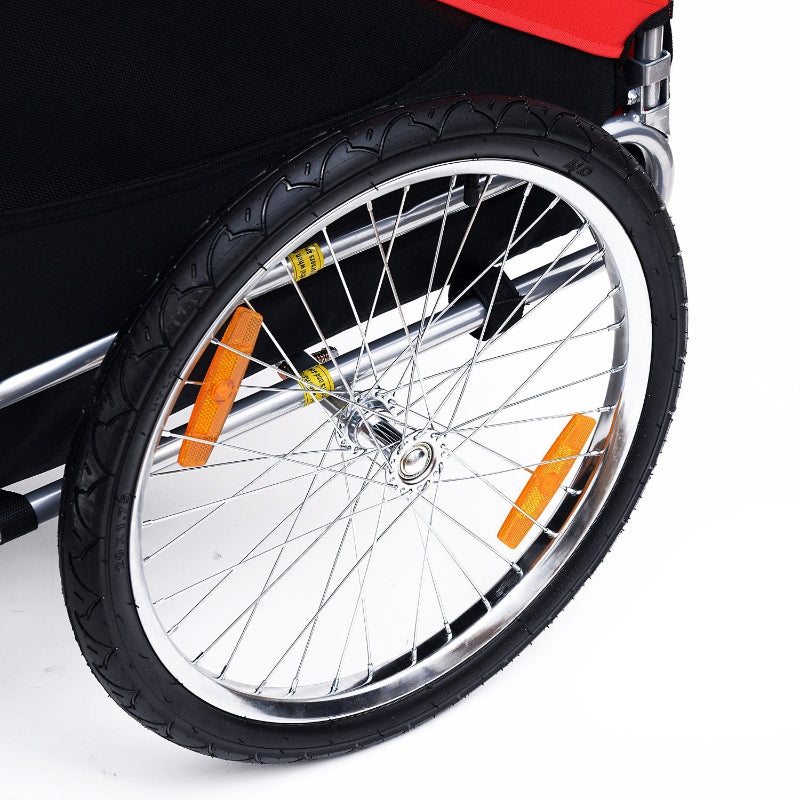 Pet trailer front wheel with black tire, silver spokes, and amber reflectors