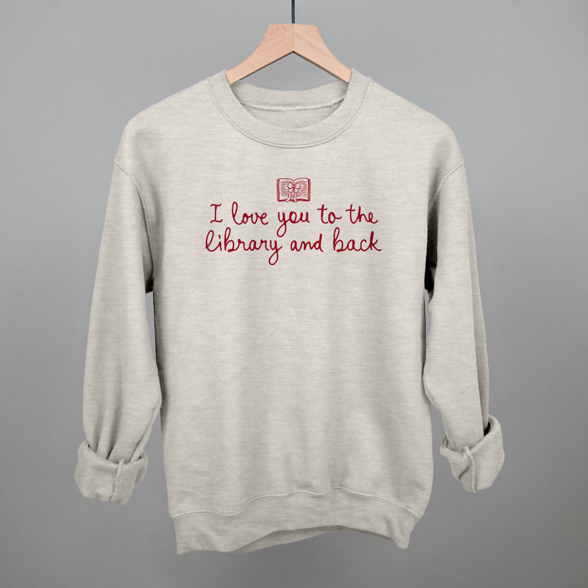 Oatmeal crewneck sweatshirt with library-and-back text graphic
