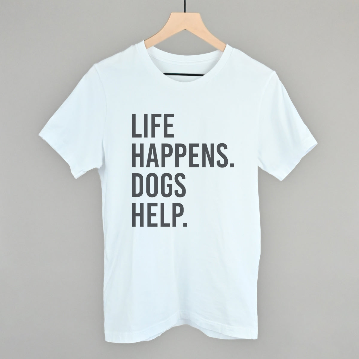 White short-sleeve tee with bold "LIFE HAPPENS. DOGS HELP." slogan print