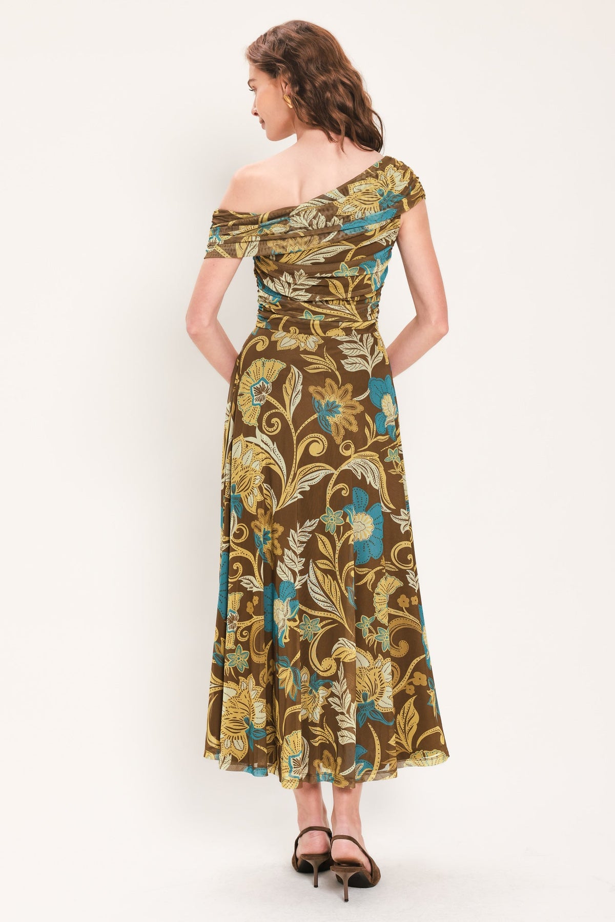 Brown and teal floral one-shoulder mesh midi dress, side/back view with off-shoulder drape.
