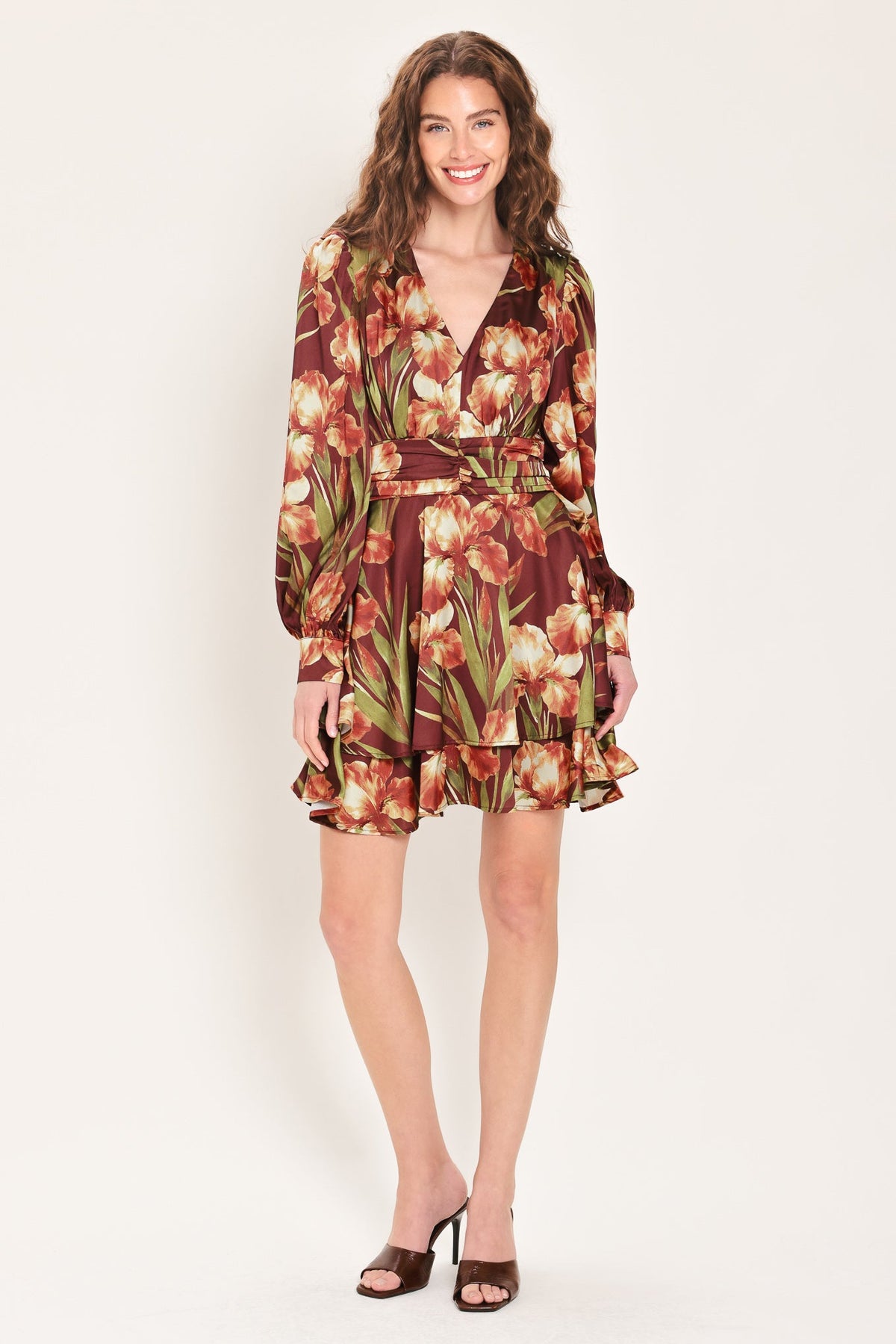 Floral mini dress with V-neck, long puff sleeves, ruched waist belt, tiered hem.
