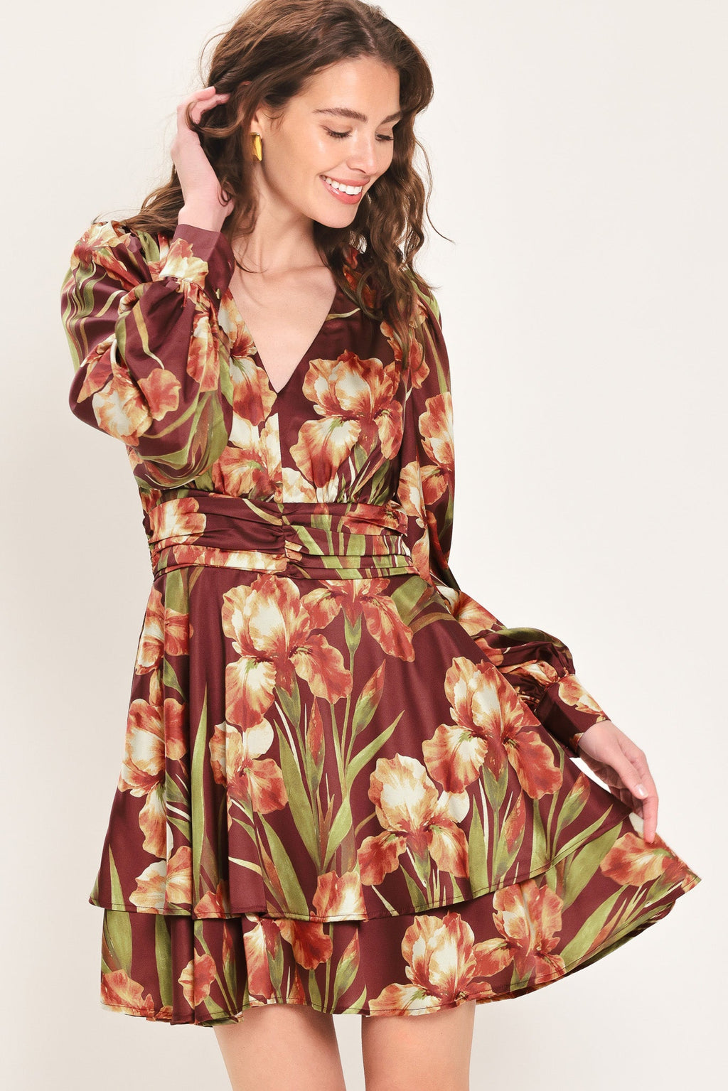 Floral mini dress with V-neck, ruched waist belt, tiered skirt, long puff sleeves.