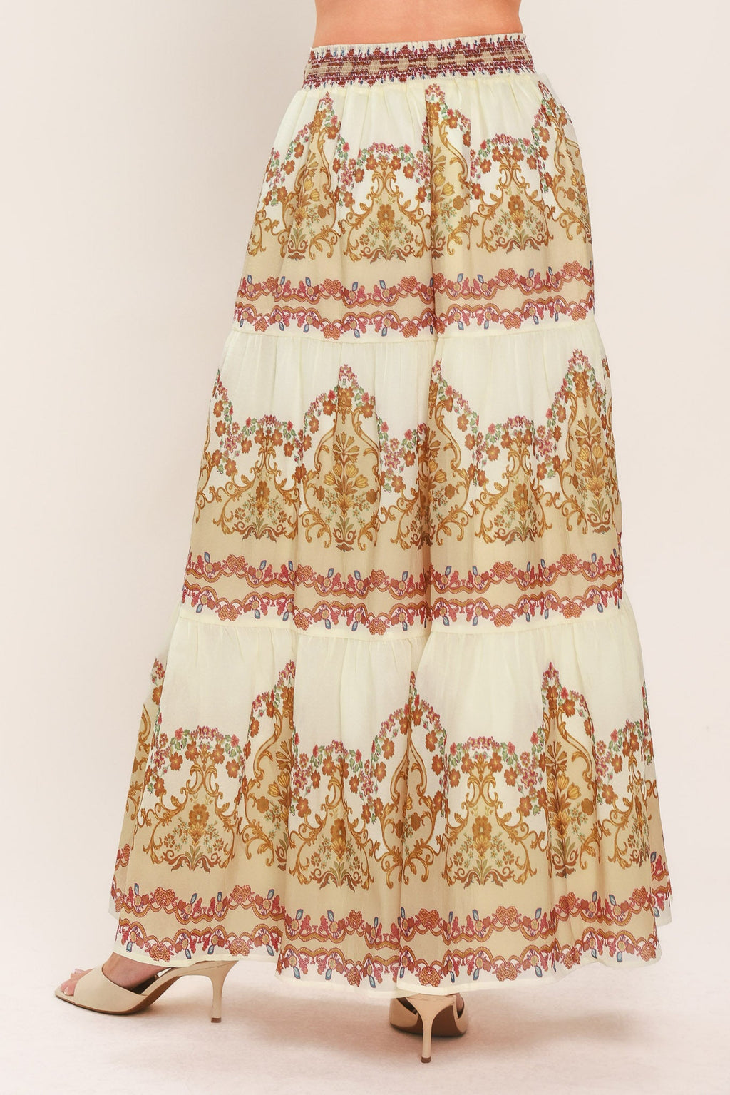 Ivory tiered maxi skirt with ornate scroll print, elastic waist, and layered tiers