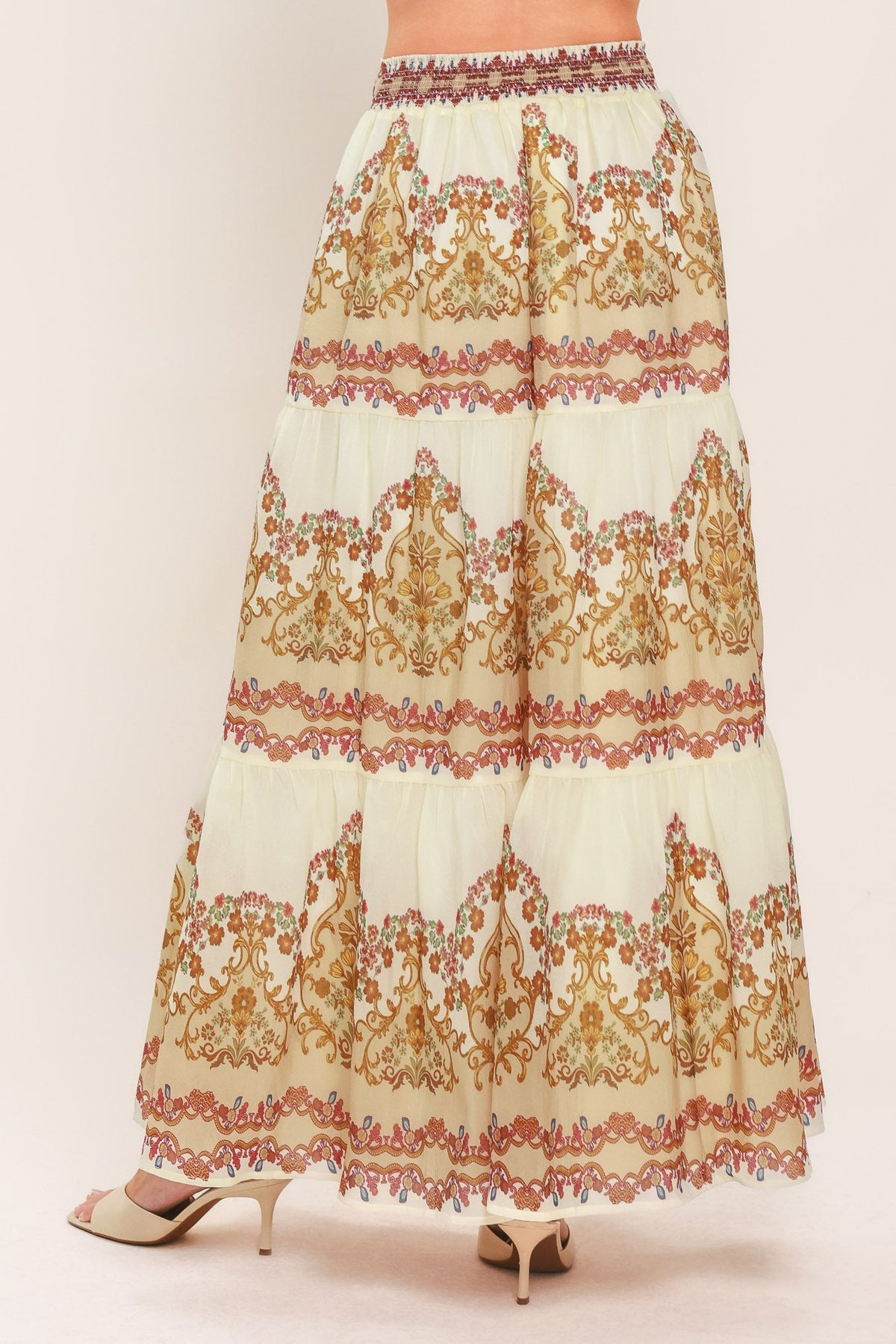 Ivory tiered maxi skirt with ornate scroll print, elastic waist, and layered tiers