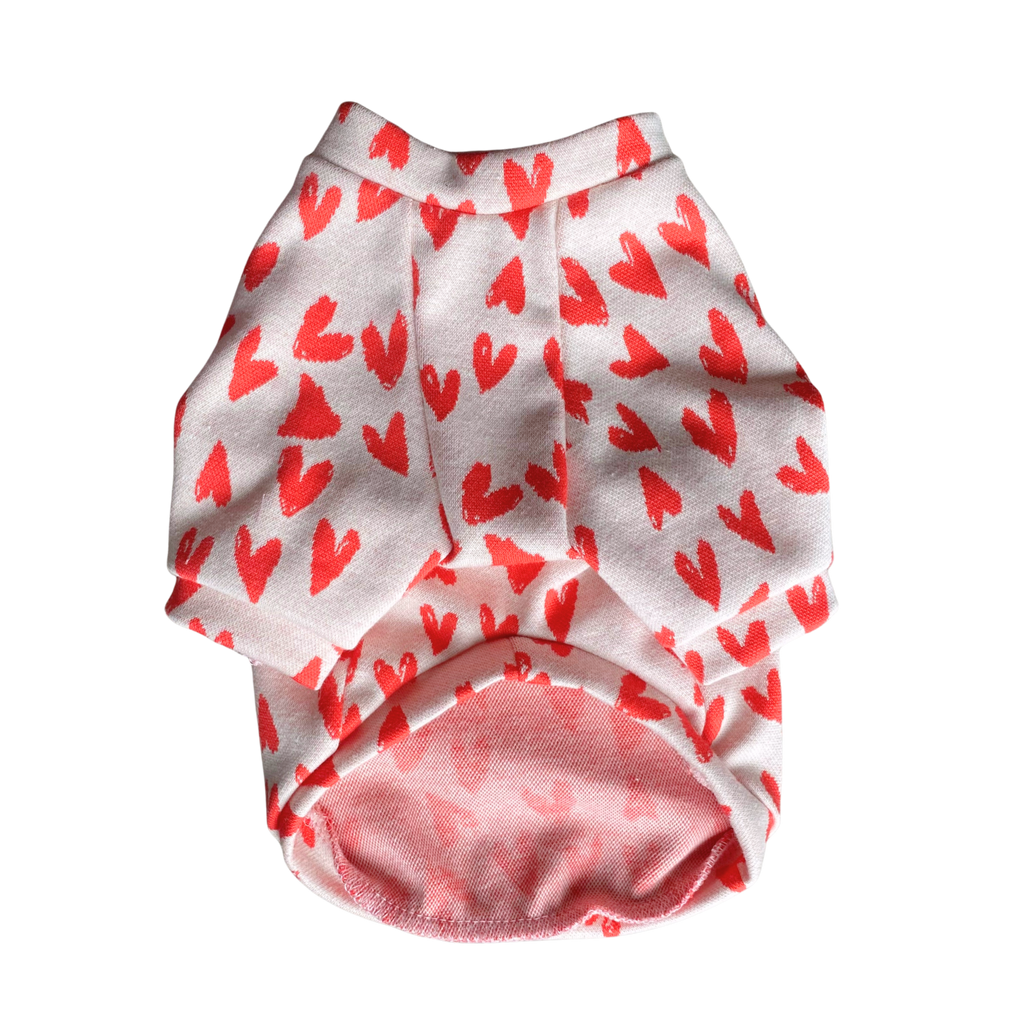 White cotton raglan shirt with red heart print and soft pink interior hem