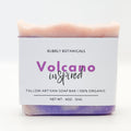 Handcrafted tallow soap bar with purple body and pink top, Volcano scent label