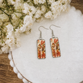 Squirrel dangle earrings with orange leaf print and silver hooks