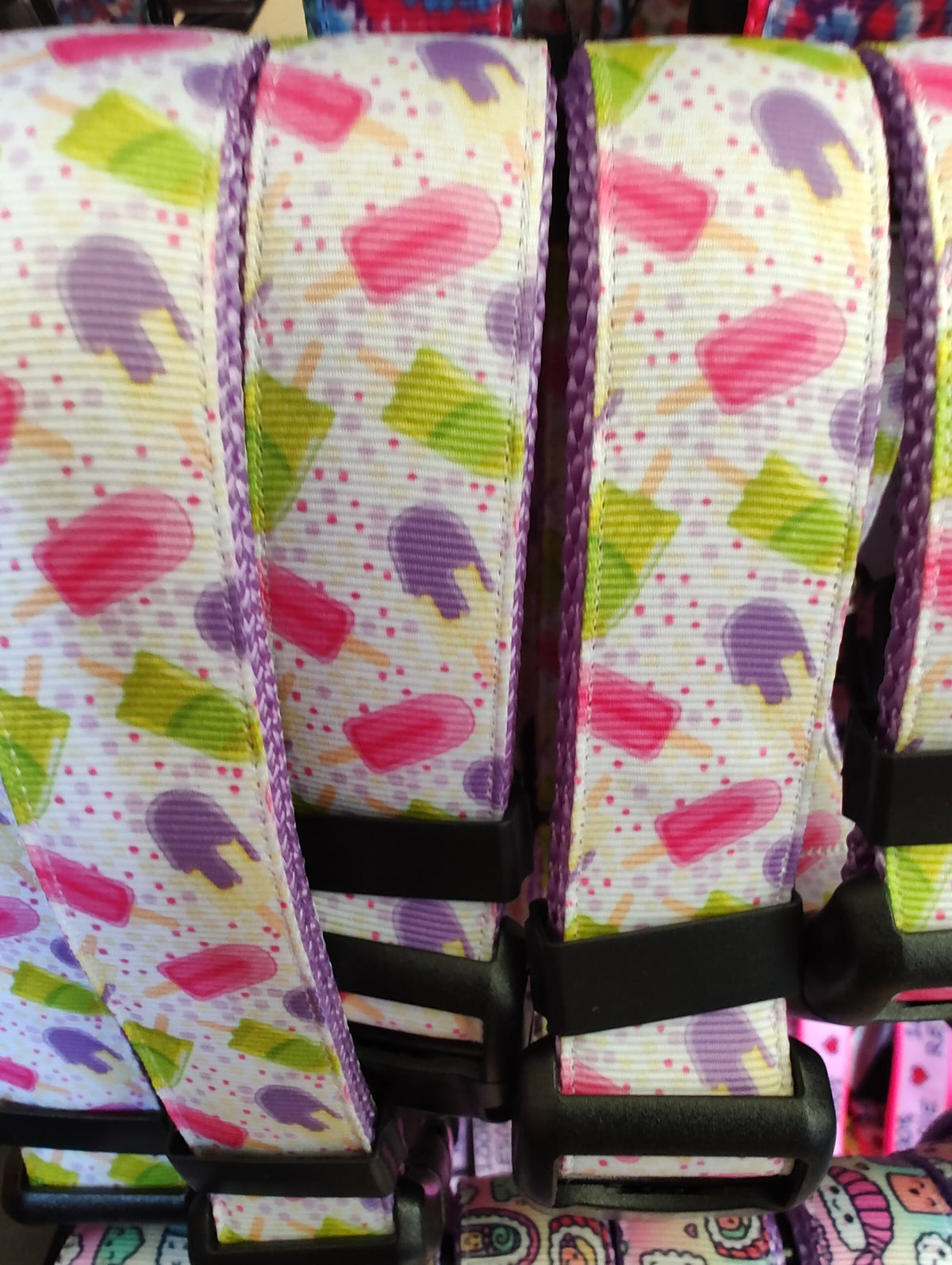 Heart-pattern nylon dog collar close-up with black adjuster and stitching