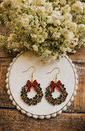 Wreath drop earrings with red berries, green leaves, and gold-tone hooks