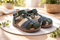 Toddler barefoot sandals in dark green with blue and silver straps, two-strap design