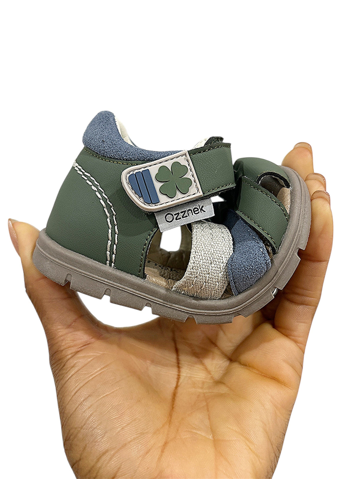 Toddler barefoot sandal sample: dark green and blue straps with clover patch and white sole