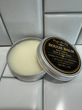 Beef tallow nose & paw balm tin with open lid, white balm inside