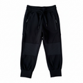 Black water-resistant hiking pants with drawstring waist and cargo pocket panels, cuffs