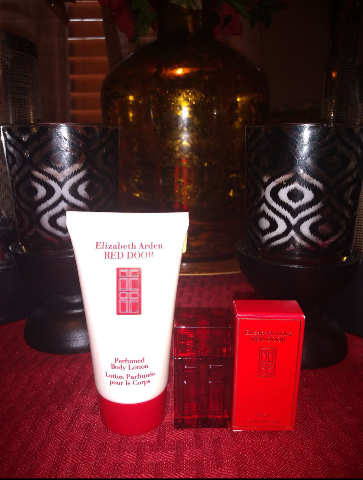 Perfume set with lotion tube, red mini bottle, and boxed fragrance