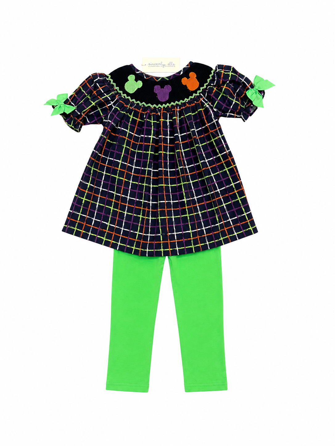 Plaid girls tunic with bat neckline, bow sleeves, and green leggings