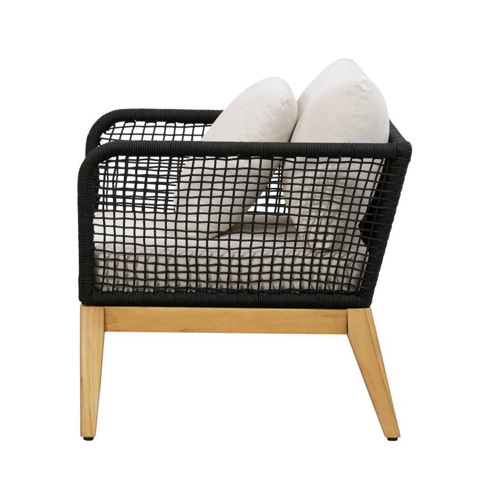 Outdoor arm chair with black woven rope back and two white cushions, teak legs