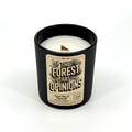 Black scented candle jar with white wax and “The Forest Has Opinions” label