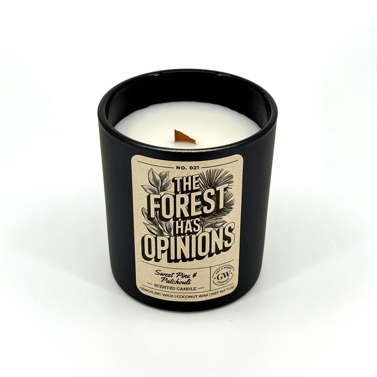 Black scented candle jar with white wax and “The Forest Has Opinions” label