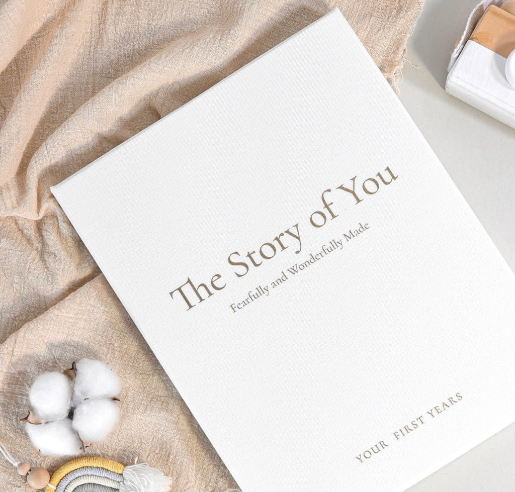White memory book cover with “The Story Of You” title and decorative border