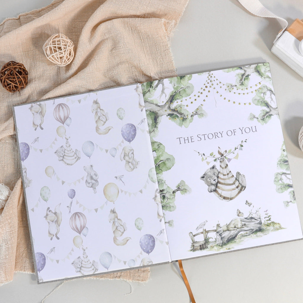 Opened baby story pages with animal illustrations and the “The Story of You” title