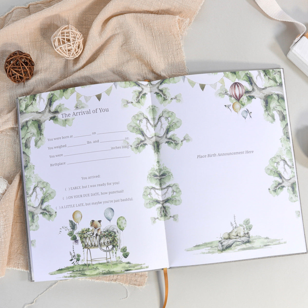Opened baby story page with “The Arrival of You” worksheet and floral borders