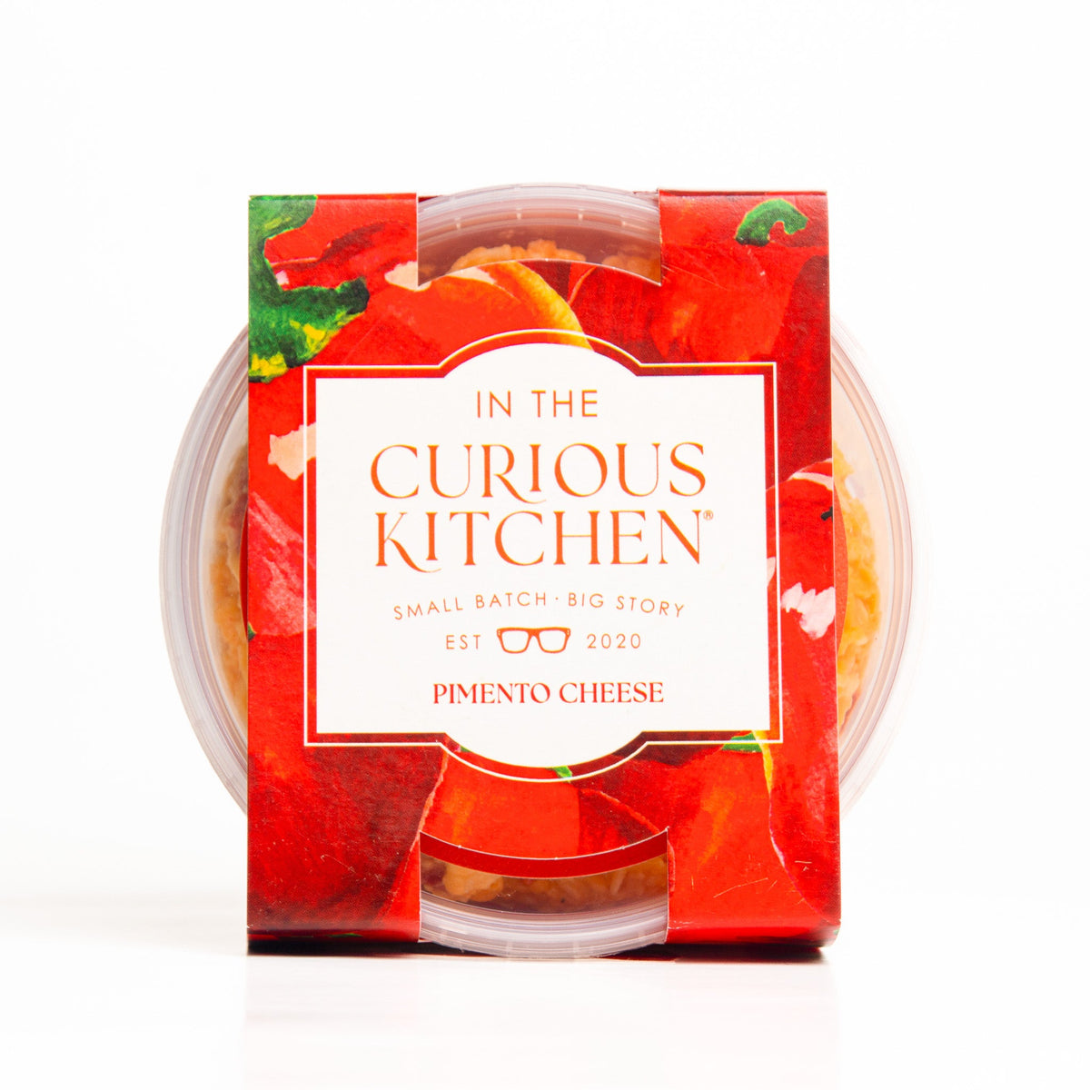 Pimento cheese spread in clear plastic tub with red label and snap lid