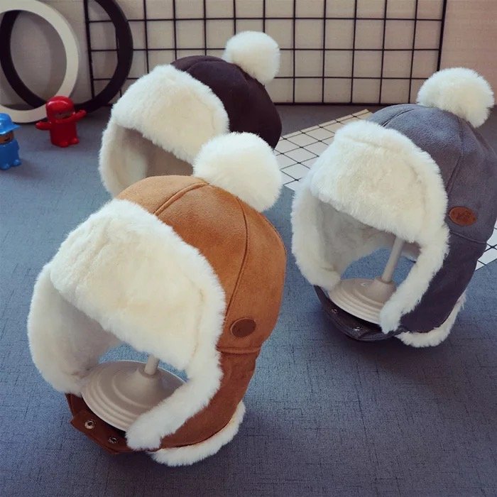 Kids trapper hat with faux fur lining, gray and brown panels, pom-pom and ear flaps