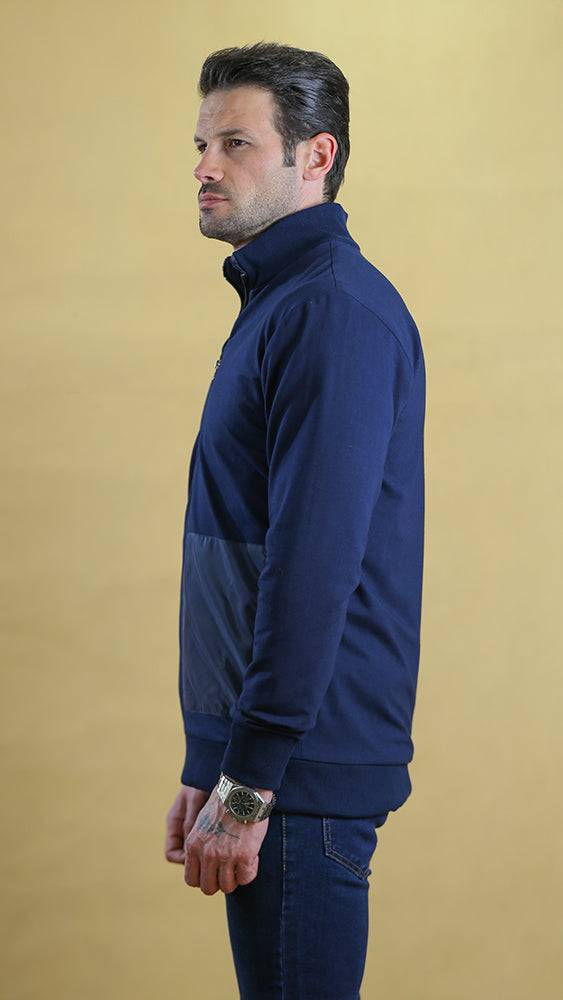 Navy quarter-panel tech sweater with side panels and stand collar, side view