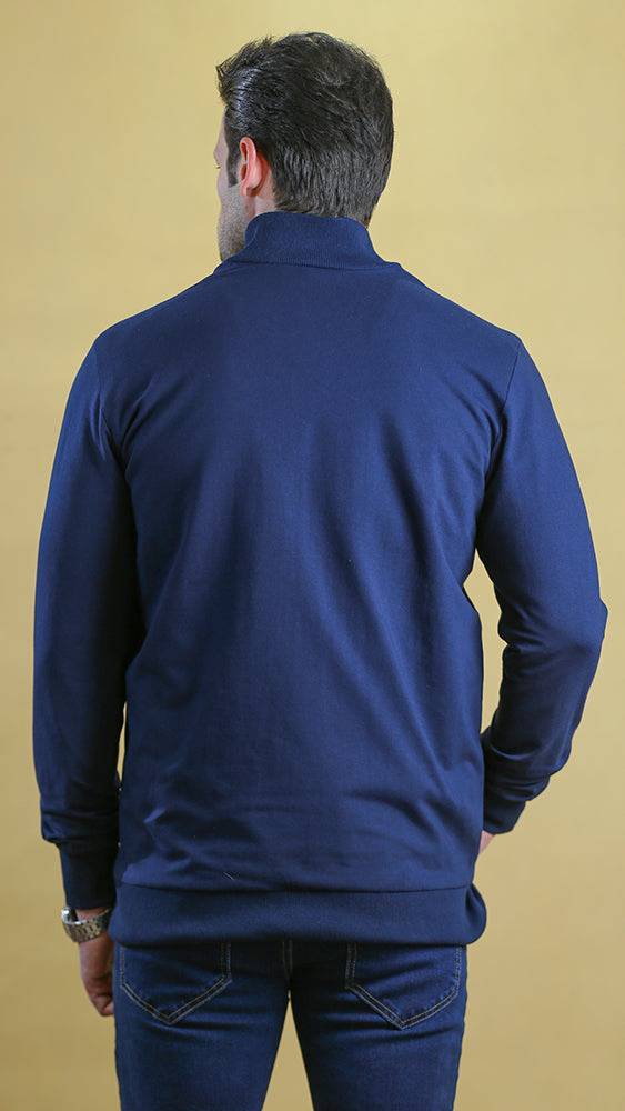 Navy quarter-panel tech sweater back view with ribbed cuffs and hem