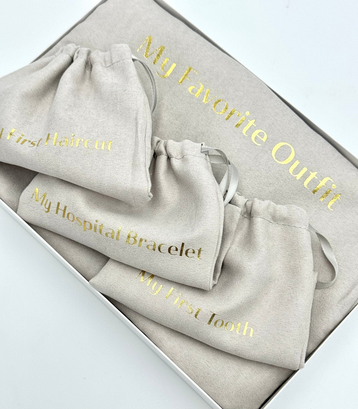 Gray keepsake pouch set with “My Favorite Outfit” lettering and a bracelet pouch